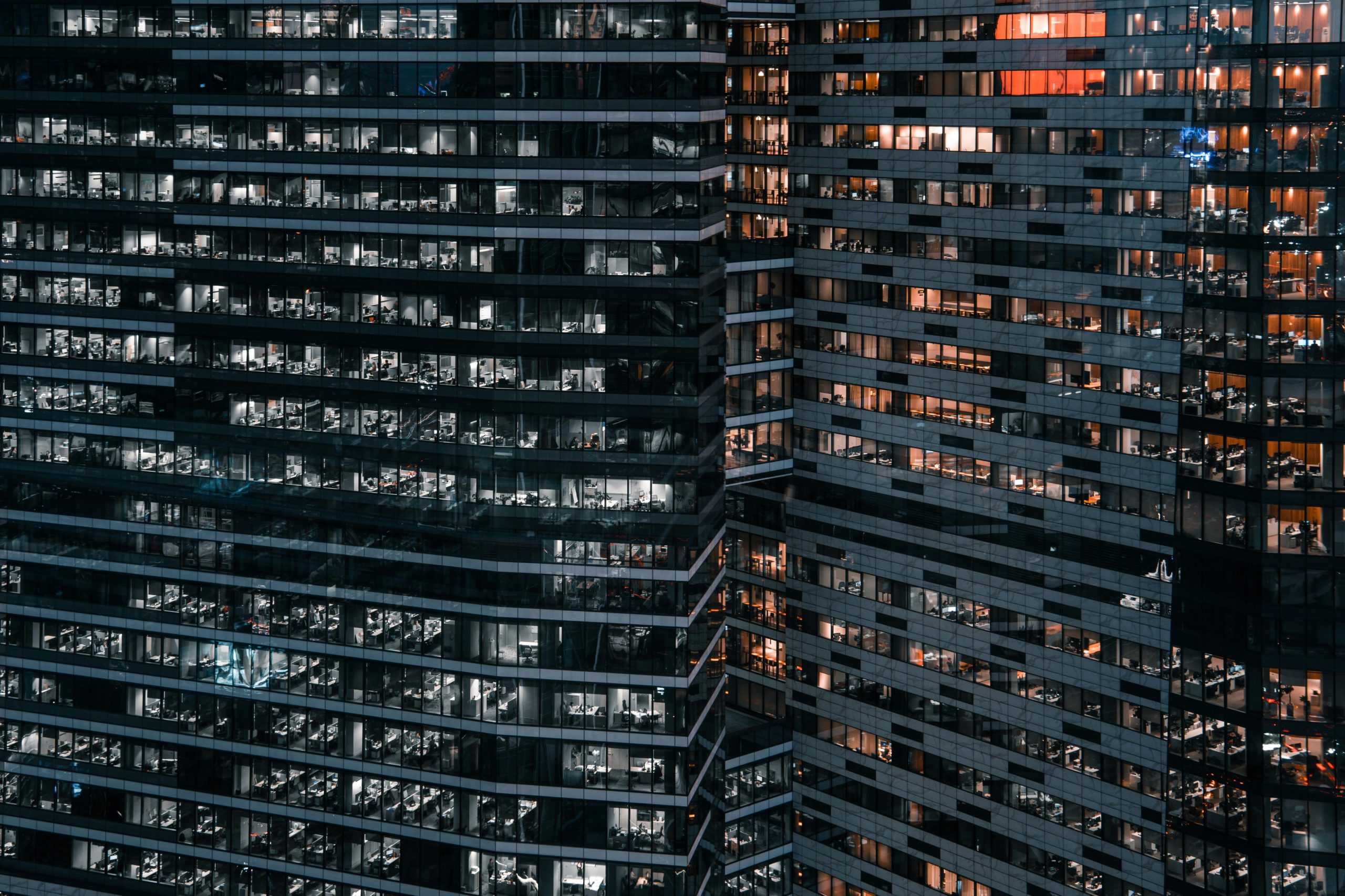 Management Liability (Directors & Officers Liability, Employment Practices Liability, Fiduciary Liability) Close-up view of modern office buildings in Moscow, showcasing urban architecture at night.